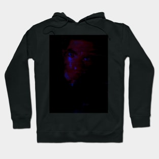 Portrait, digital collage and special processing. Man looking on us from darkness. Eyes. Red and blue. Darker eyes. Hoodie